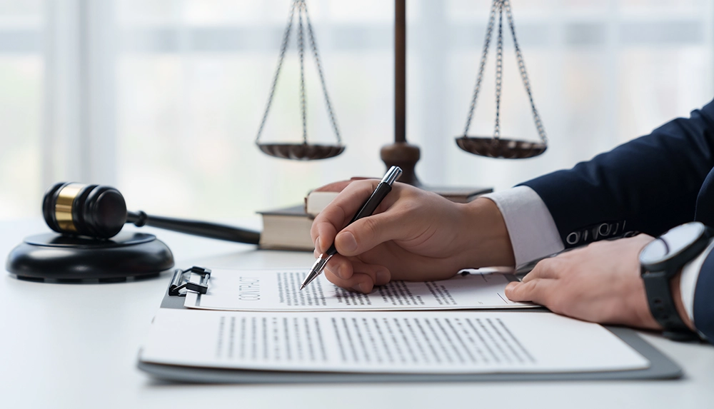 Law firm professional signing documents